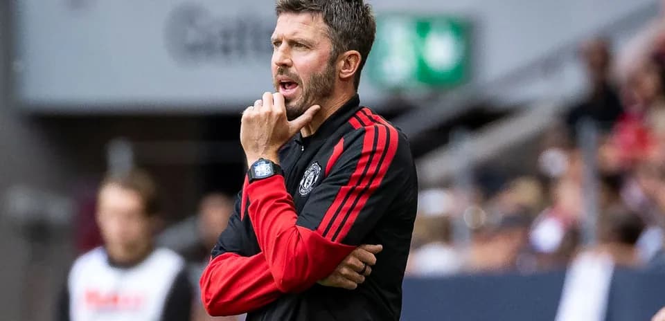 Coach gesturing during a football match on sidelines