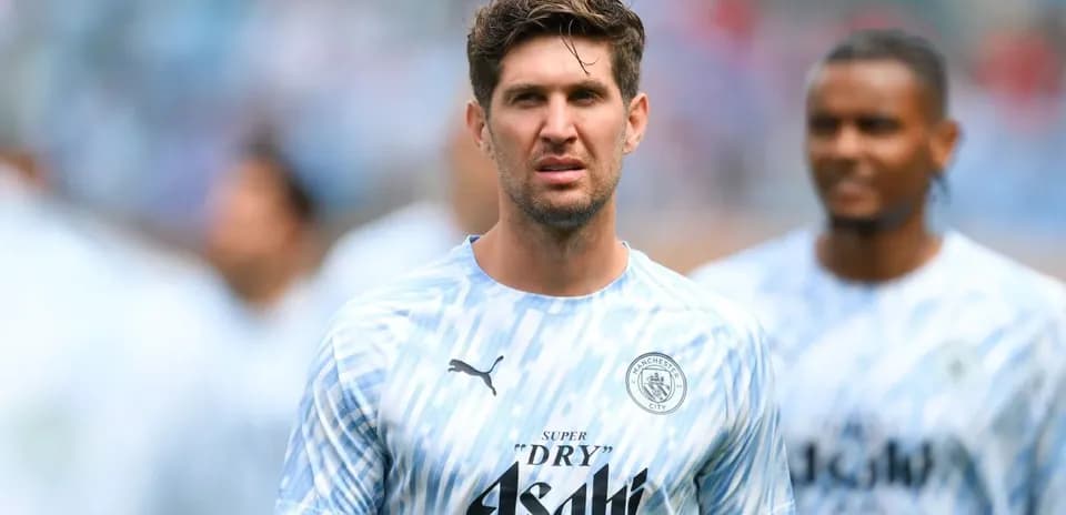 Player in Manchester City training kit on pitch