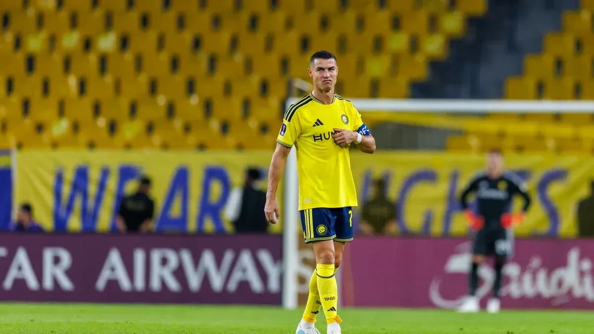 Player in yellow kit standing on the field