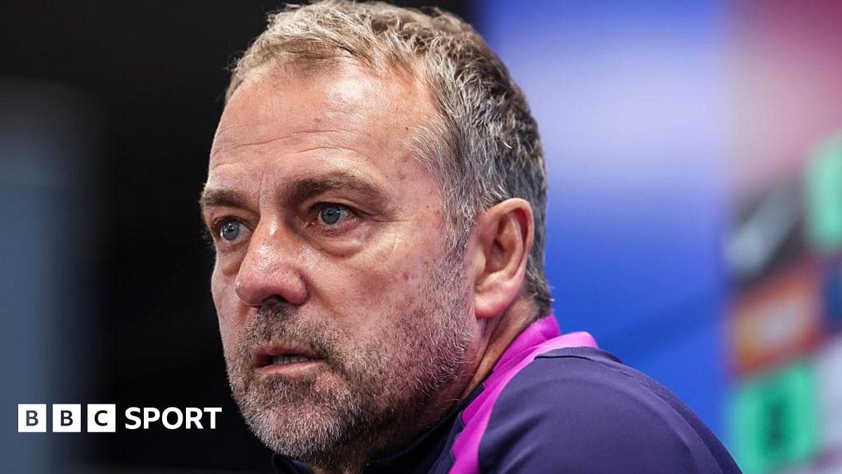Coach speaking during a press conference