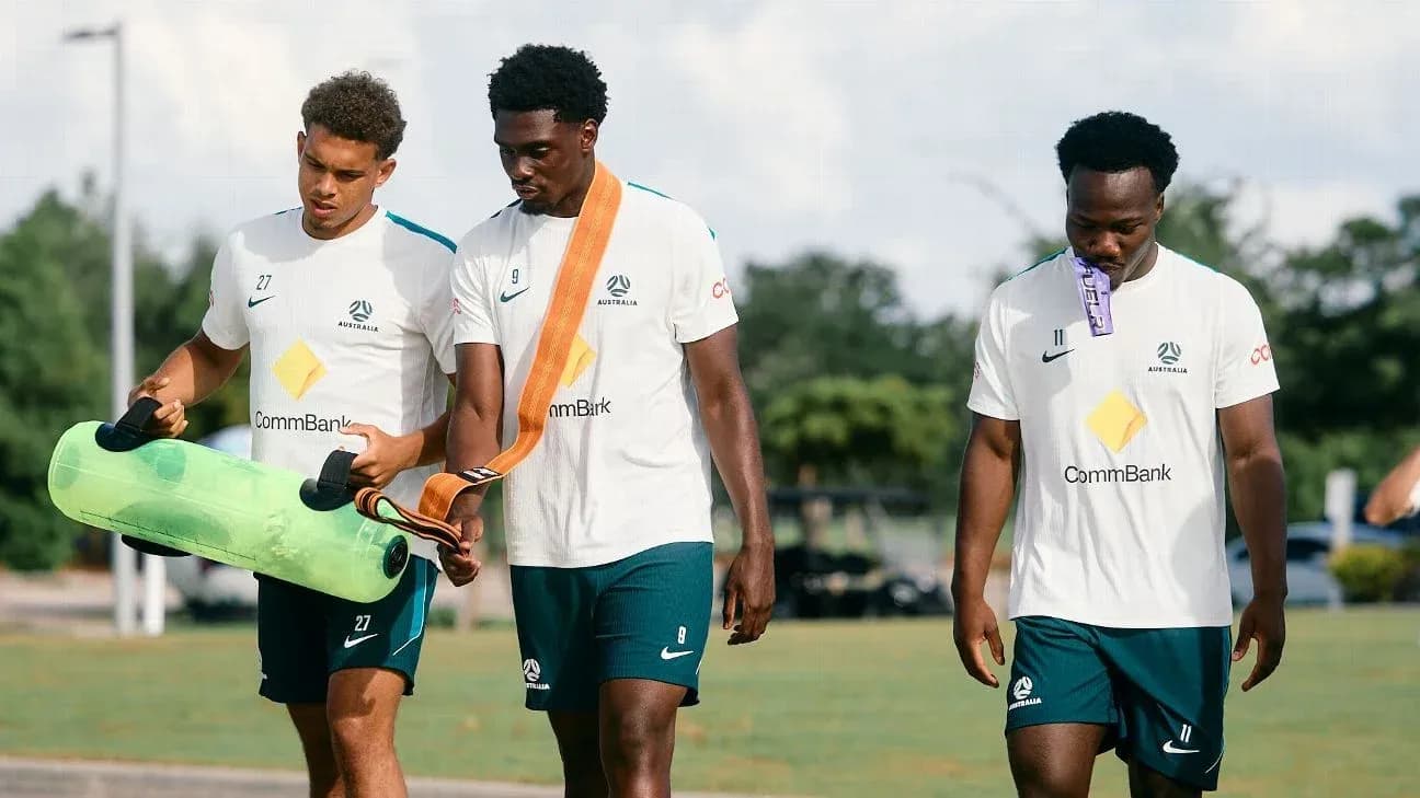Three players walking during training session