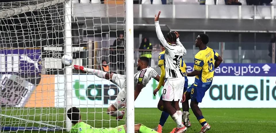 Juventus player attempting to score against Parma