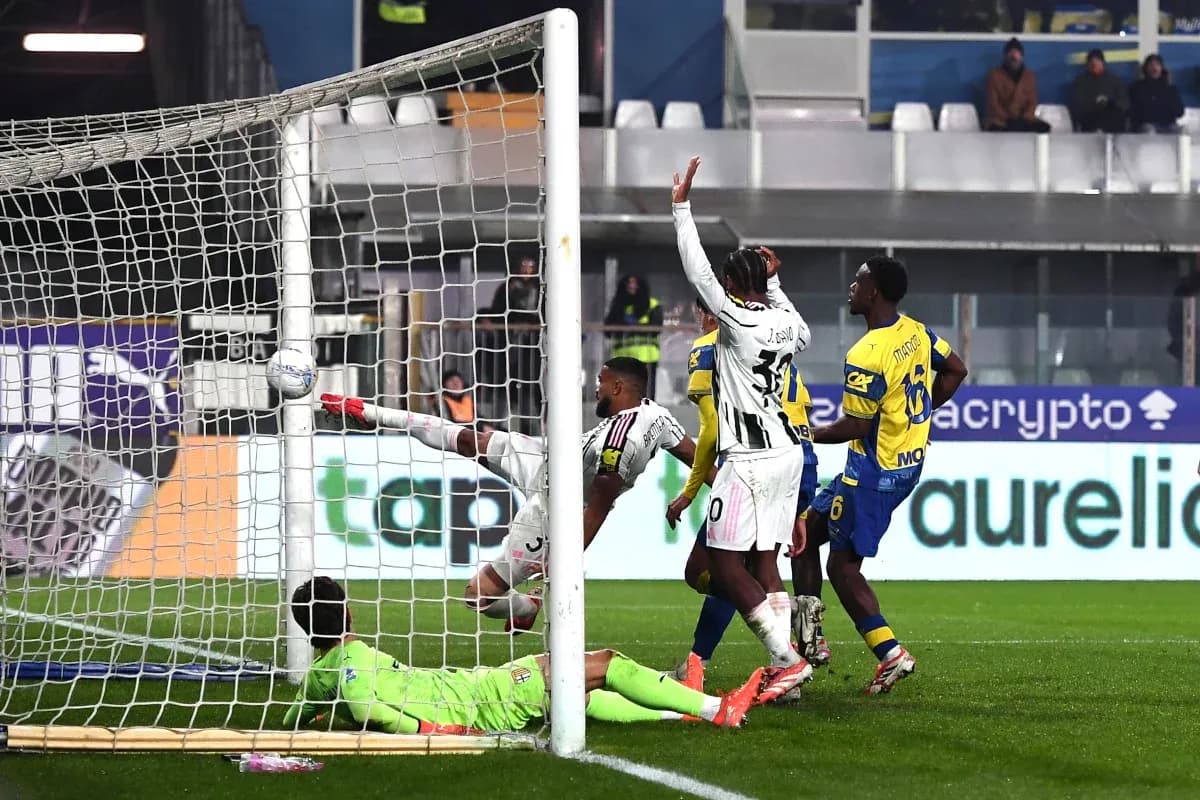Juventus player attempting to score against Parma
