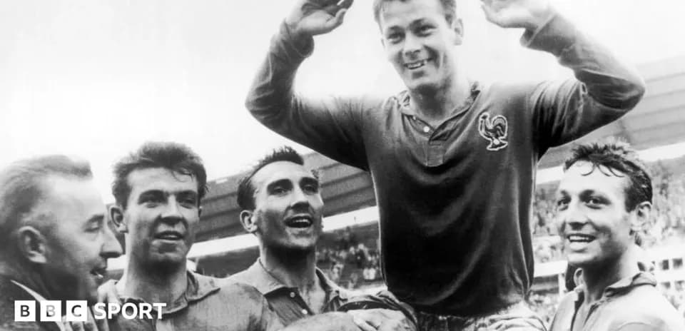 Players celebrating a victory, one lifted on shoulders