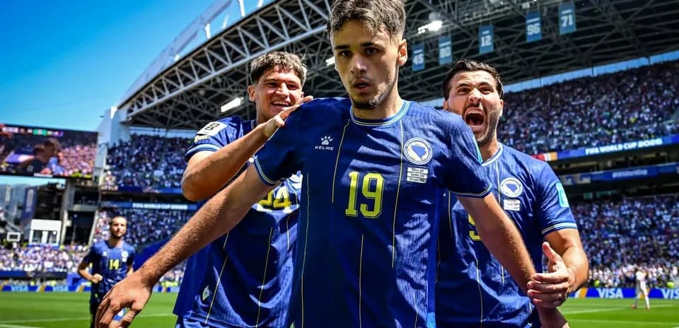 Bosnia players celebrating a goal on the pitch