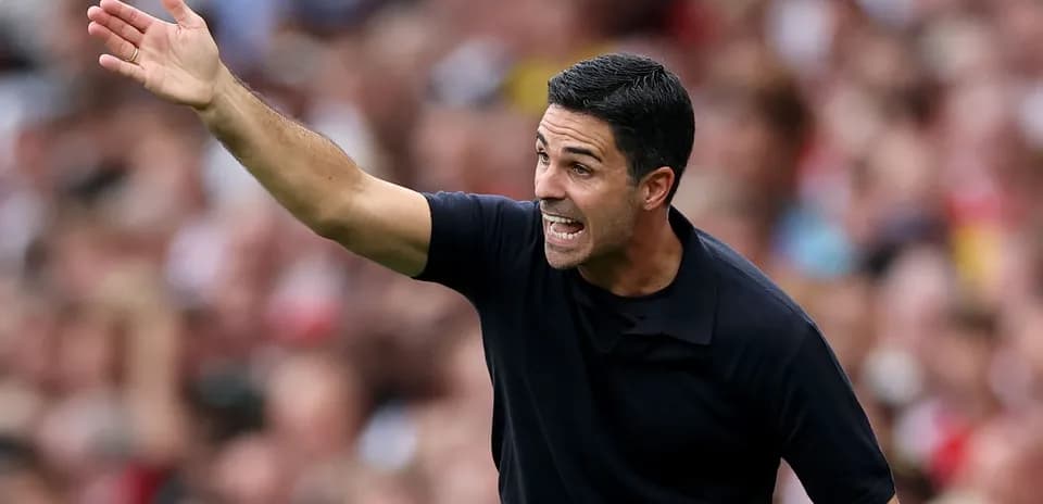 Manager gesturing during a football match