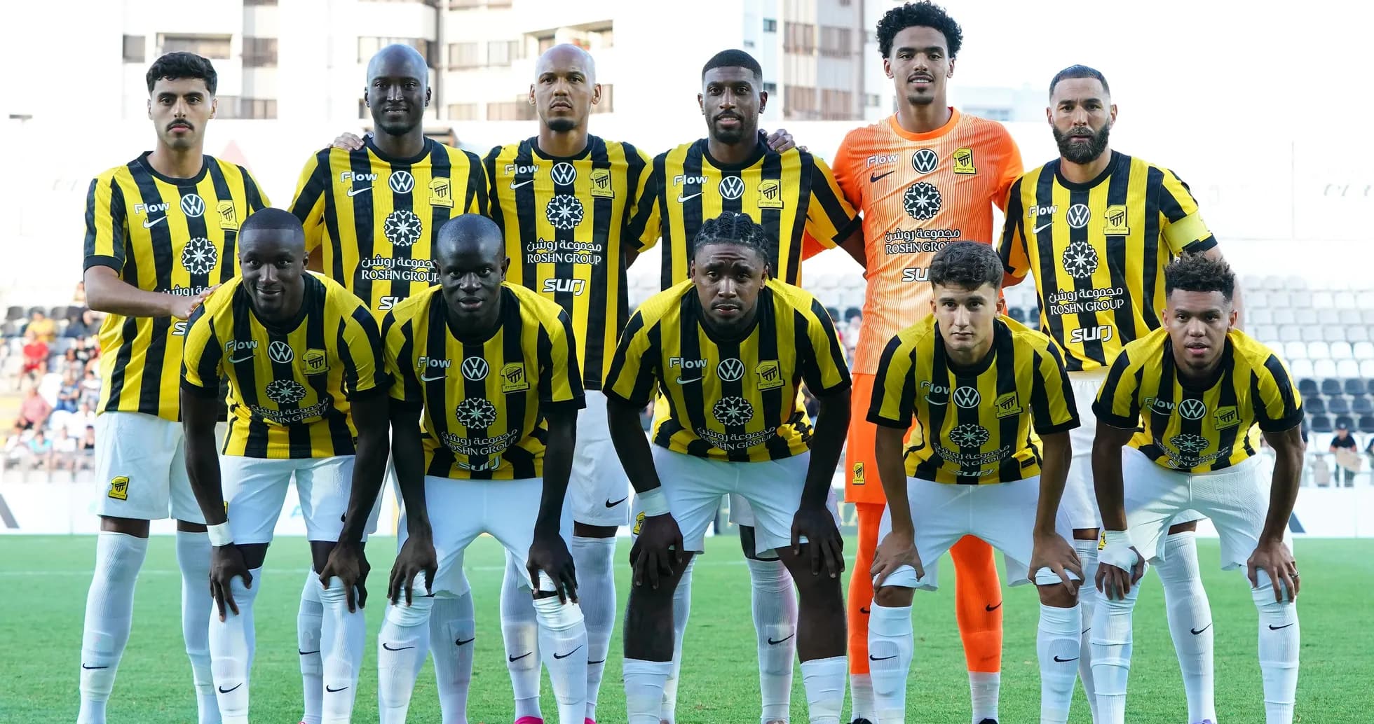 Football team posing for group photo in uniforms