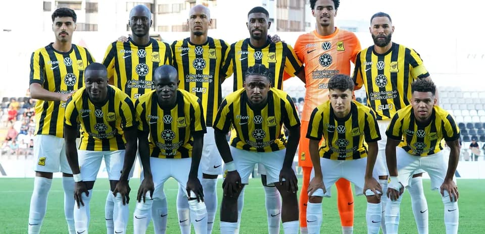 Football team posing for group photo in uniforms