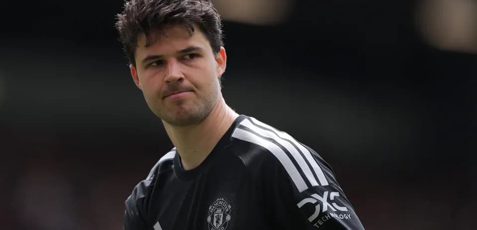 Goalkeeper wearing Manchester United kit on field