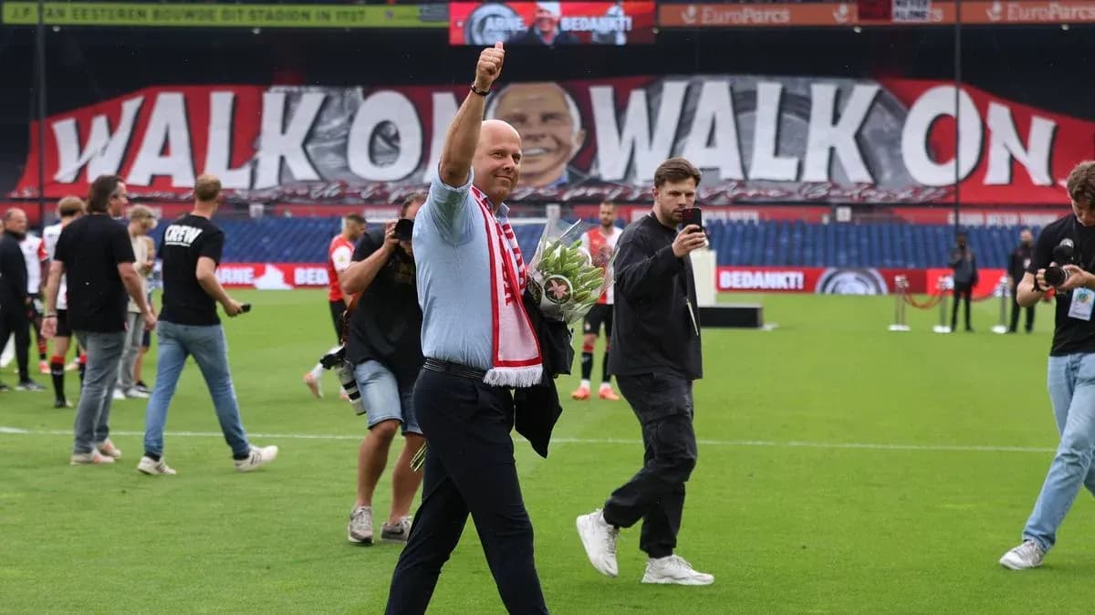 Man waving with bouquet in stadium celebration