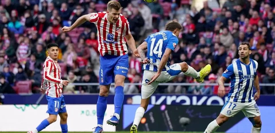 Players competing for the ball in La Liga match
