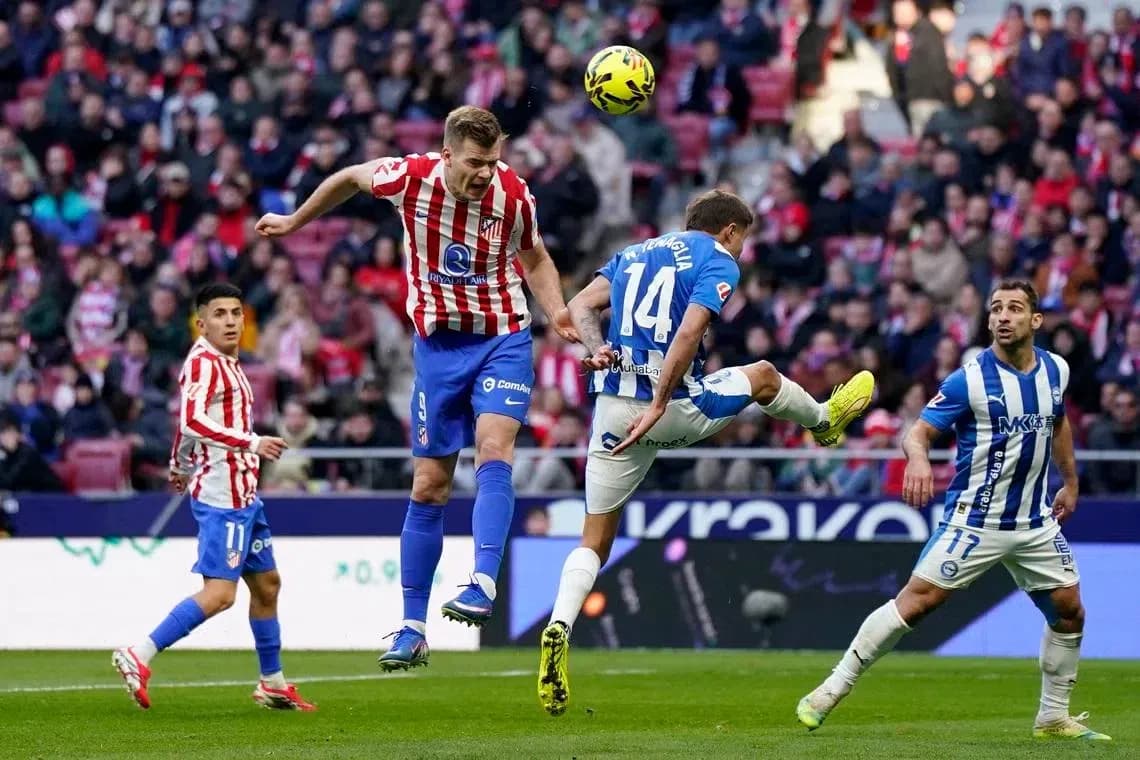 Players competing for the ball in La Liga match