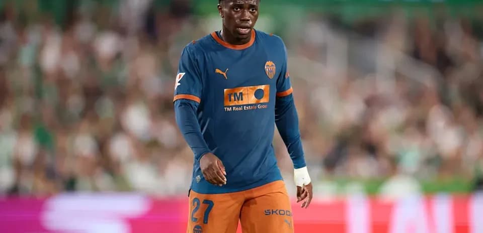 Valencia player walking on the pitch during match