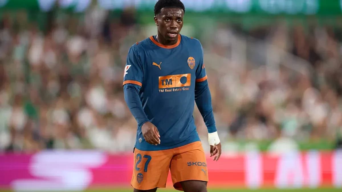 Valencia player walking on the pitch during match