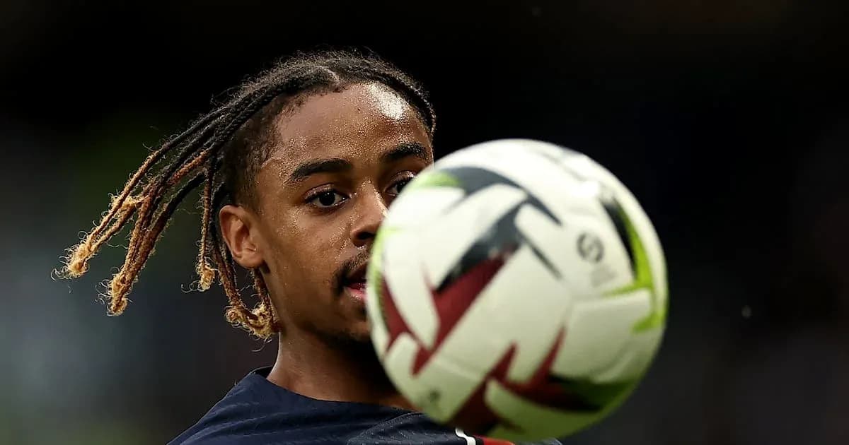 Player controlling a soccer ball during warm-up
