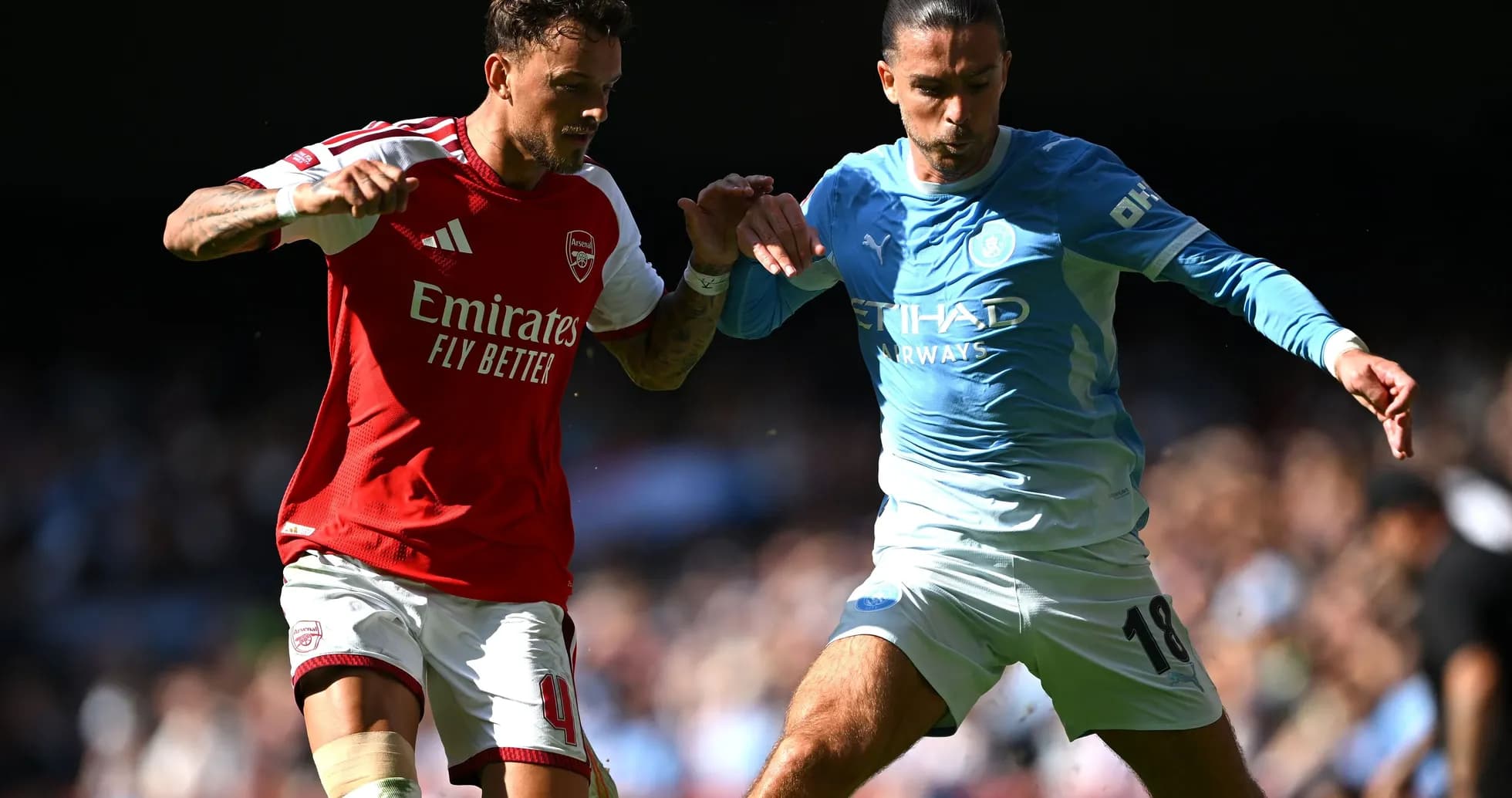 Two players contesting the ball during match