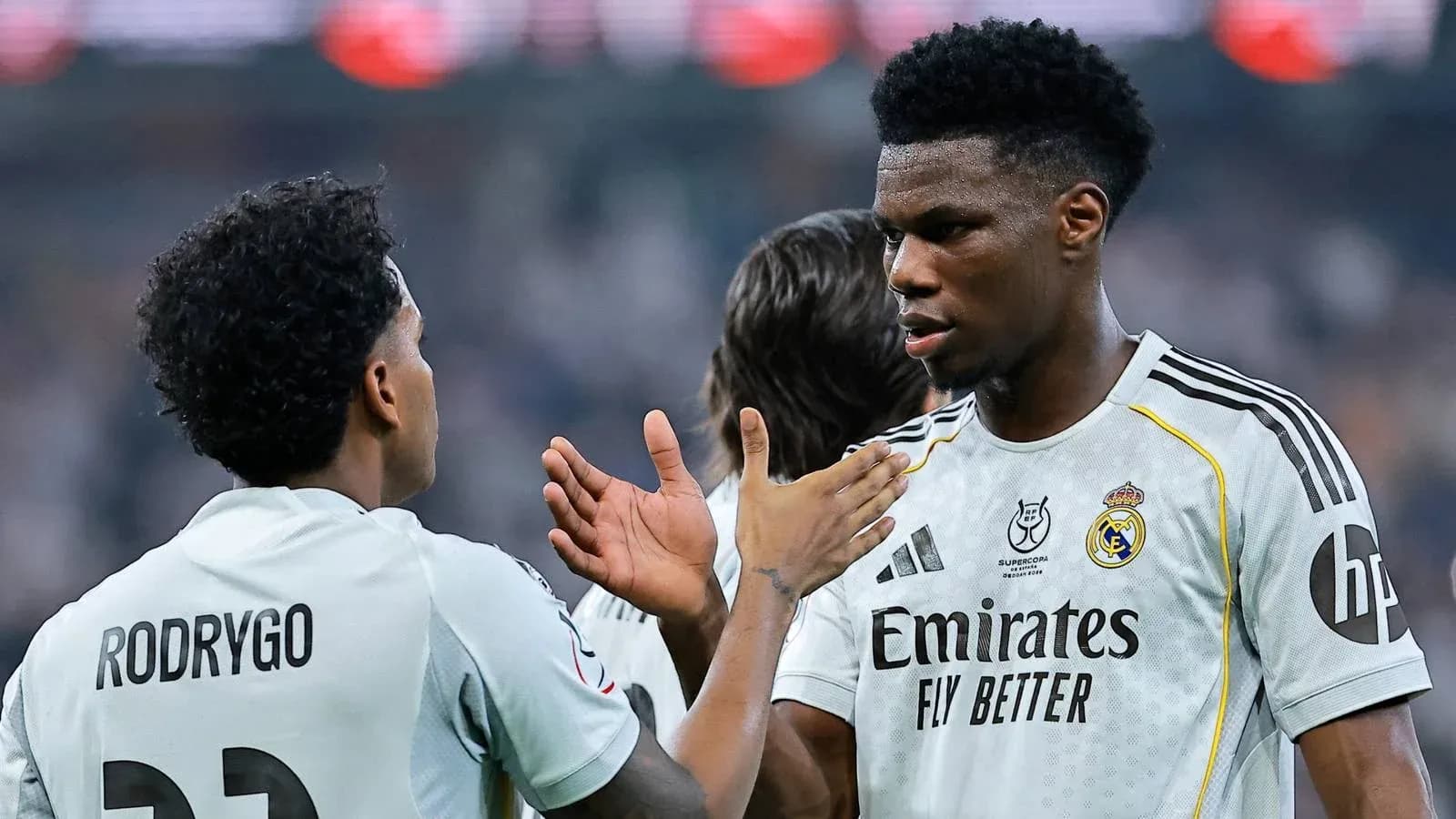 Rodrygo and Aurélien Tchouaméni discussing on the field