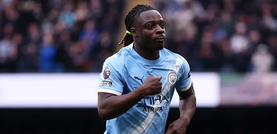 Player celebrating a goal in Manchester City kit