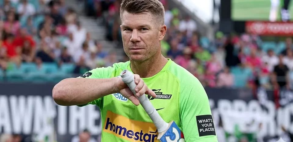 Player preparing to bat during a cricket match