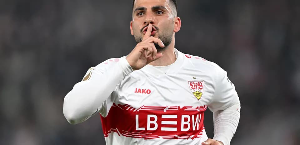 Player celebrating with a shushing gesture after scoring