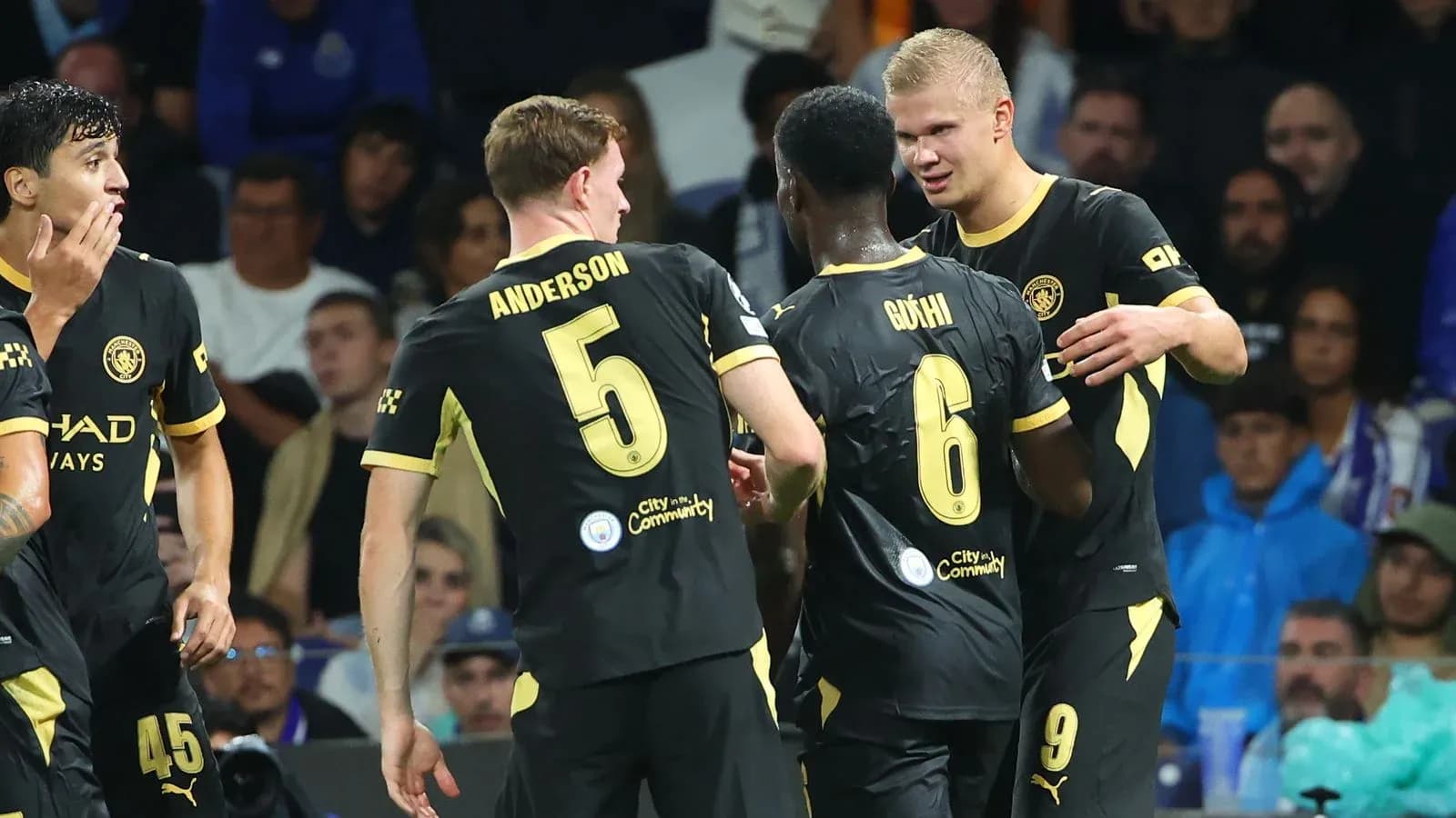 Players celebrating a goal during a match