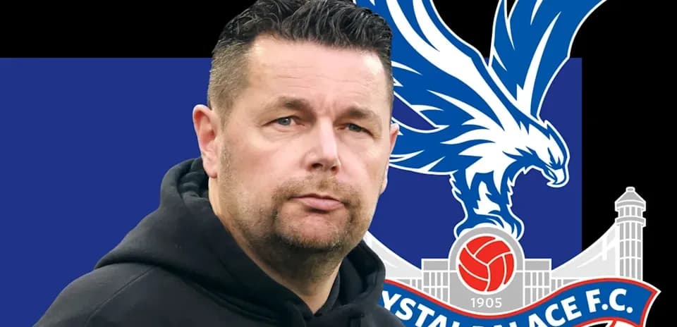 Coach in front of Crystal Palace FC logo