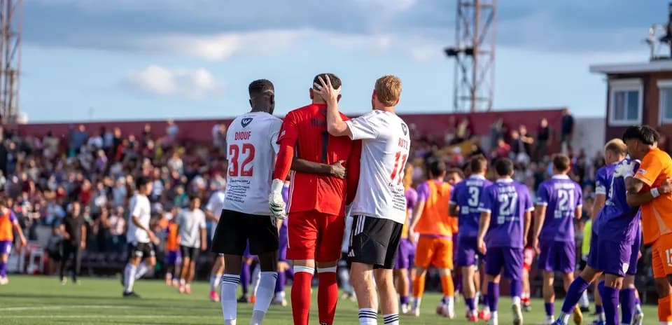 Players interacting after the match