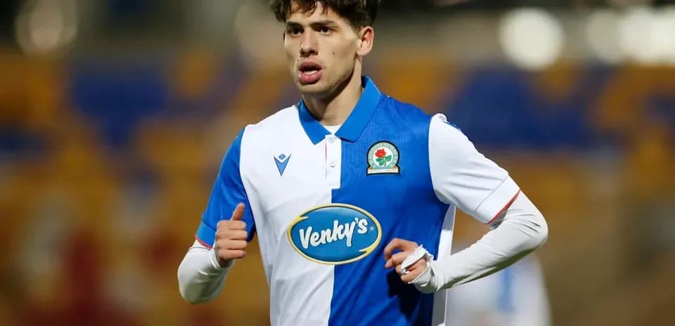 Player wearing Blackburn Rovers kit during match