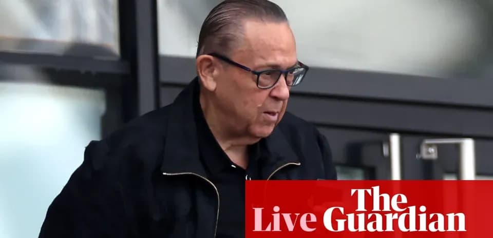 Man in black jacket leaving a building