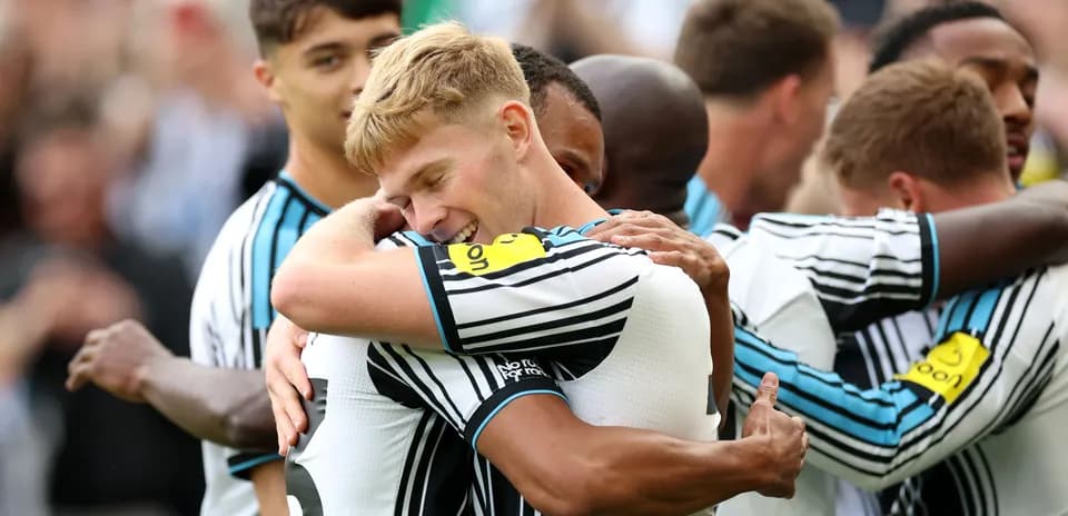 Players celebrating together after scoring a goal