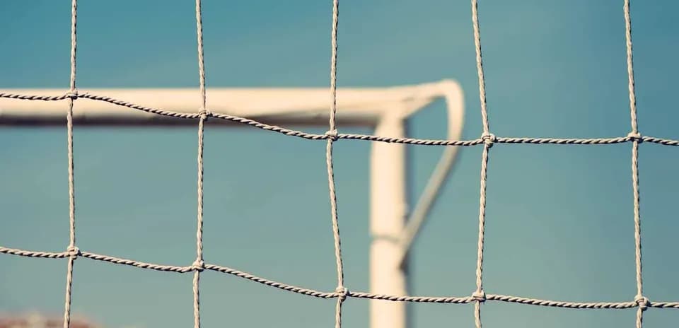 Close-up of a soccer goal net and frame