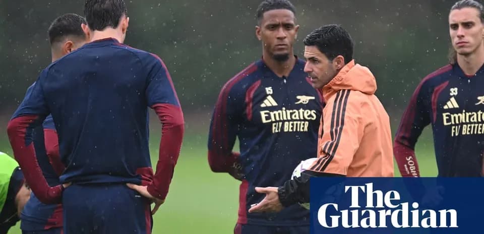 Manager discussing strategy with players during training