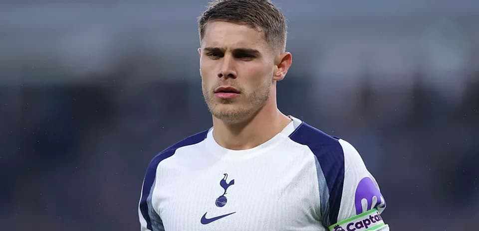 Player in Tottenham kit with captain's armband