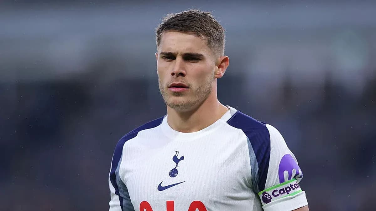 Player in Tottenham kit with captain's armband