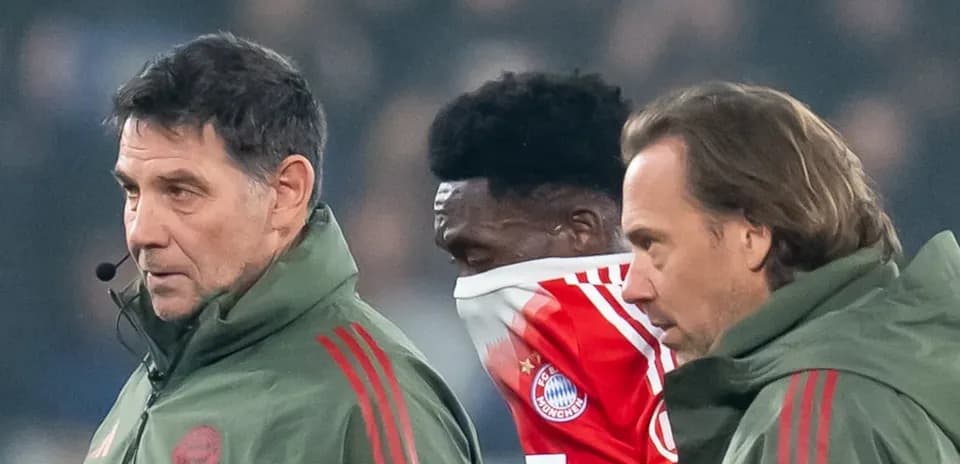 Coaches and player during a match substitution