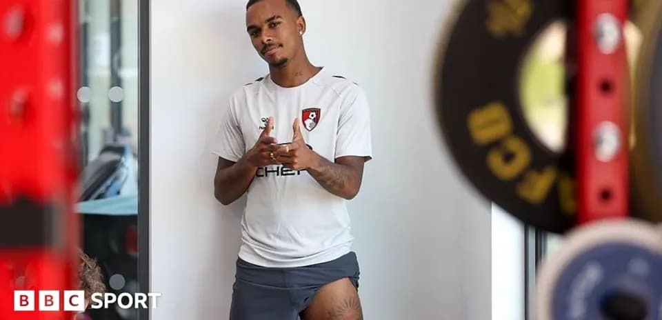 Player posing in training gear at gym