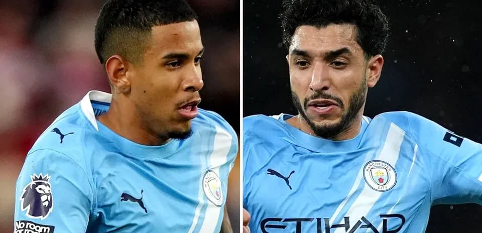 Two Manchester City players in light blue kits