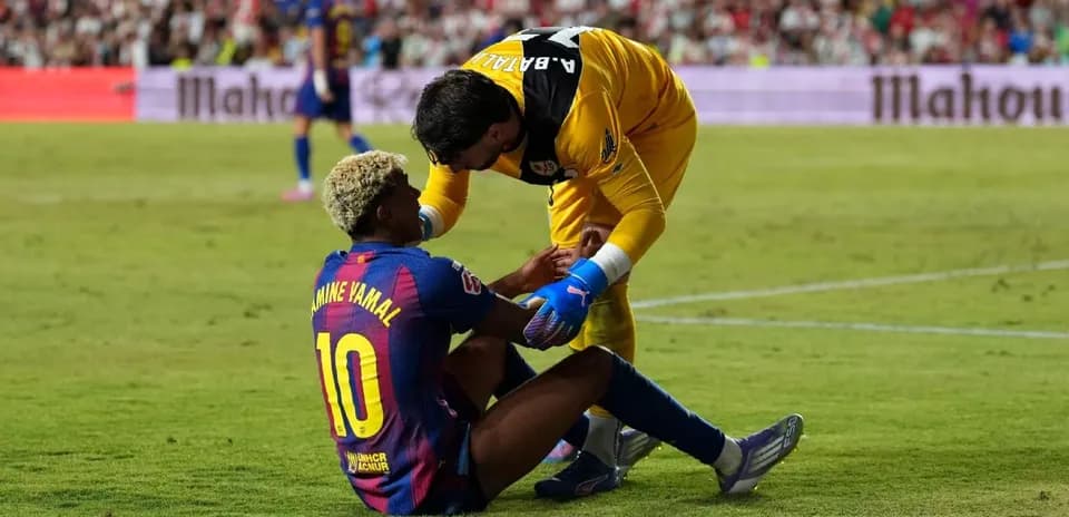 Barcelona player receiving assistance during match