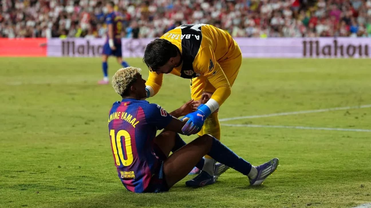 Barcelona player receiving assistance during match