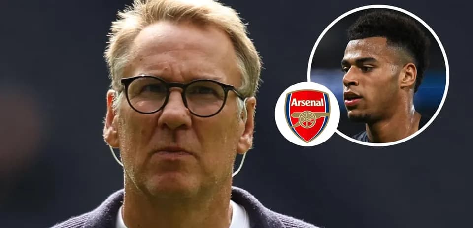 Man in glasses with Arsenal logo and player image