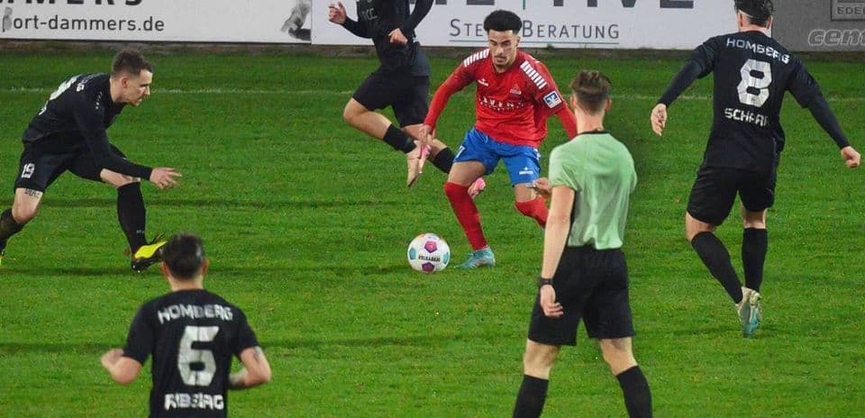 Players competing for the ball during match