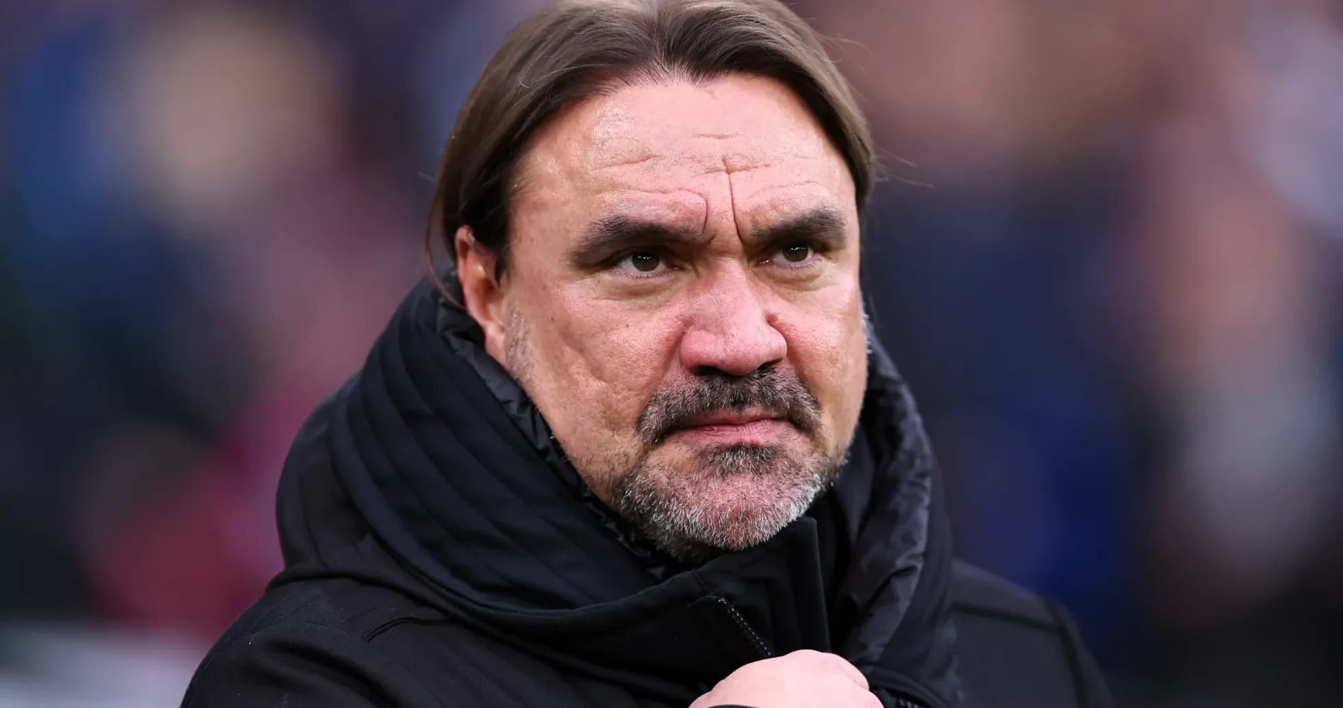 Coach with serious expression during match