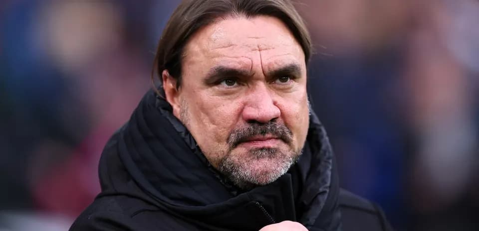 Coach with serious expression during match