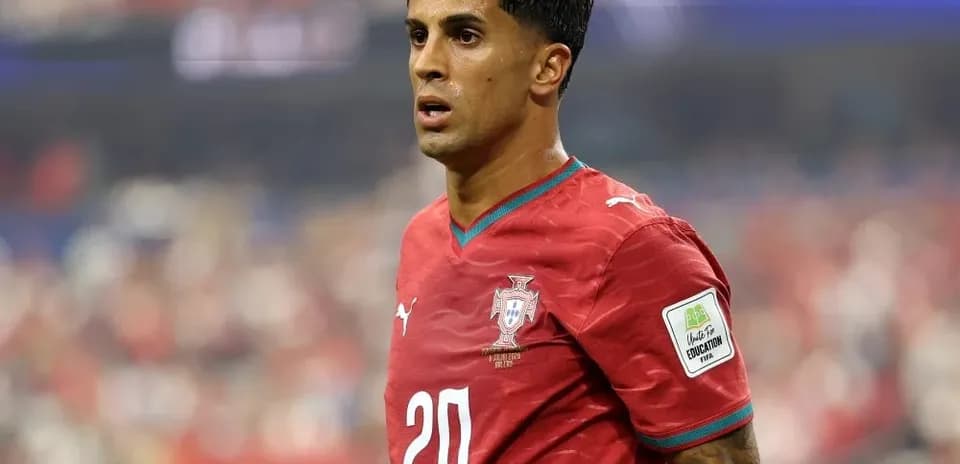 Player wearing red Portugal jersey during match