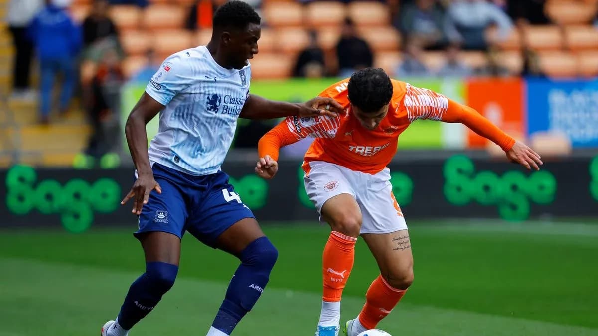 Two players competing for the ball during match