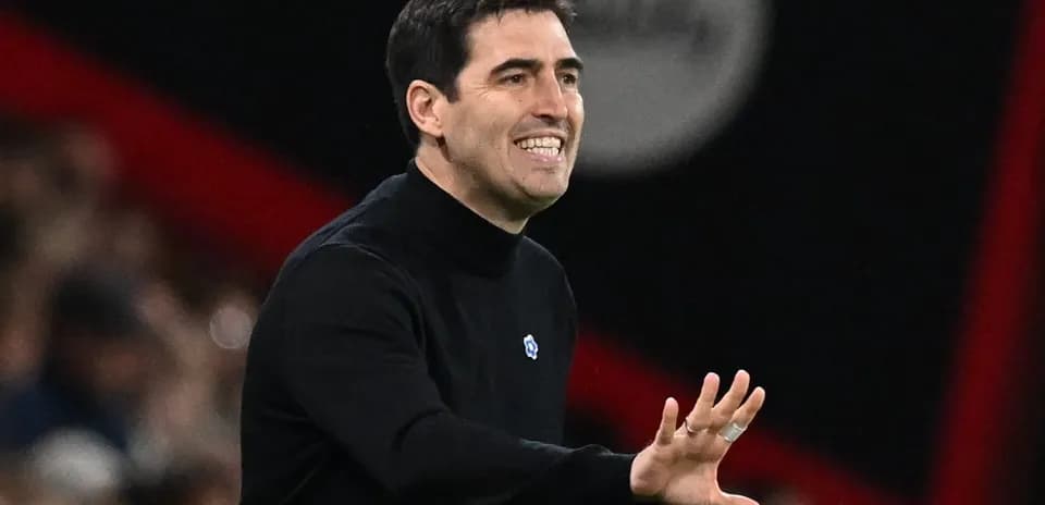 Coach gesturing during a match from the sidelines