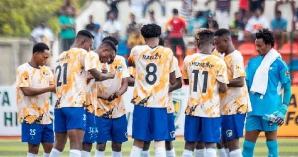 Team huddled together during warm-up before match