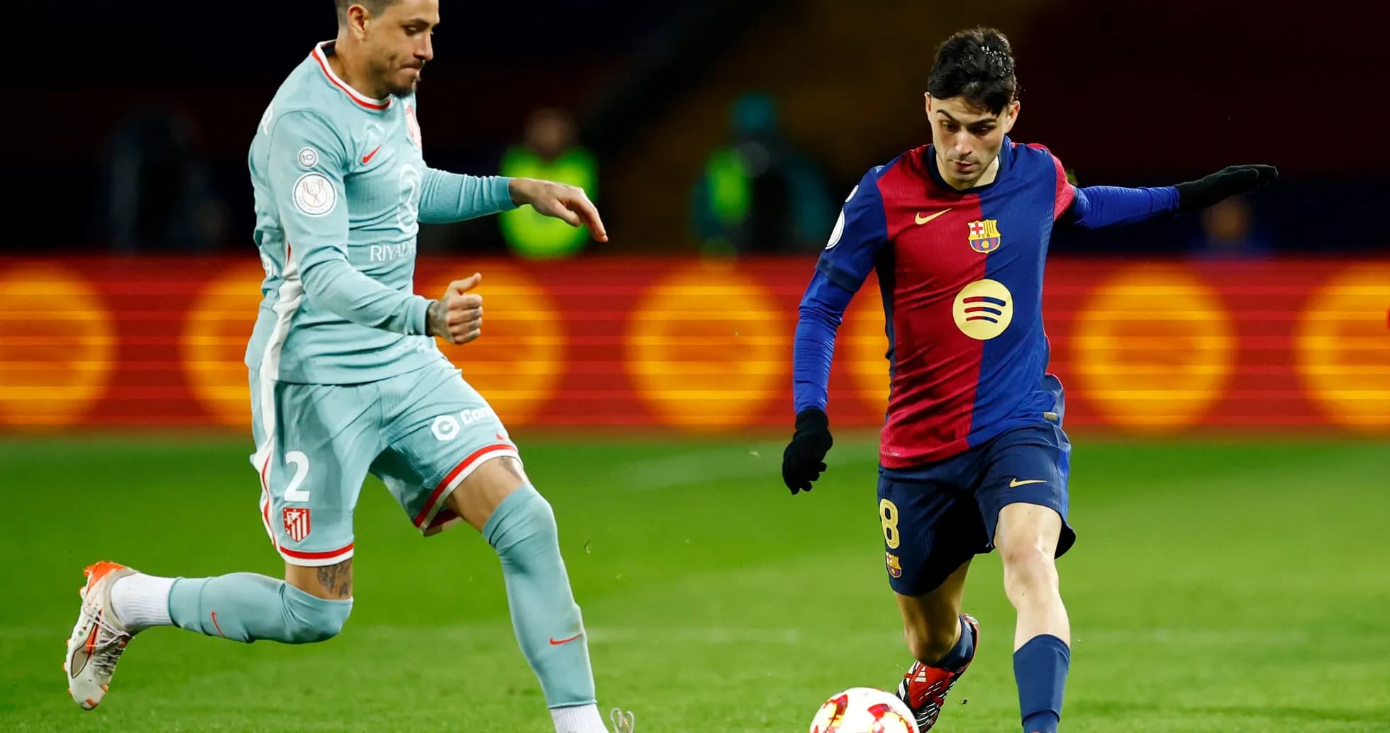 Atletico Madrid and Barcelona players in action