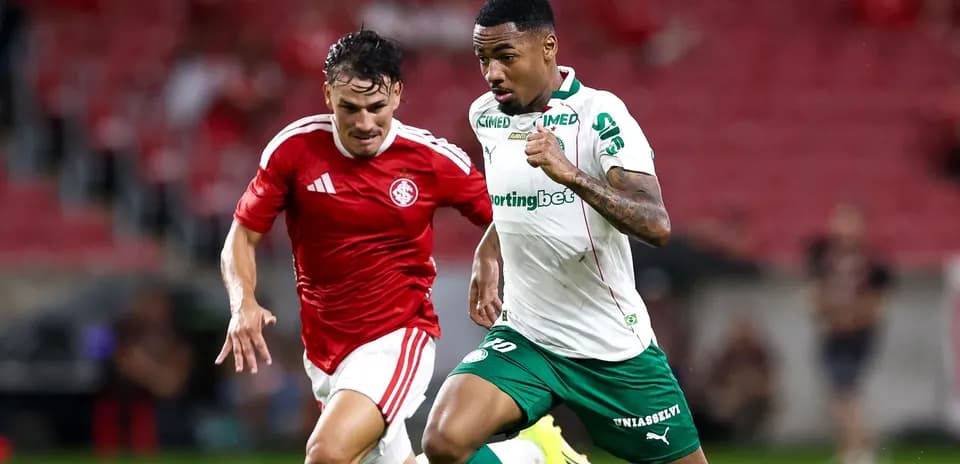 Two players sprinting for the ball during match