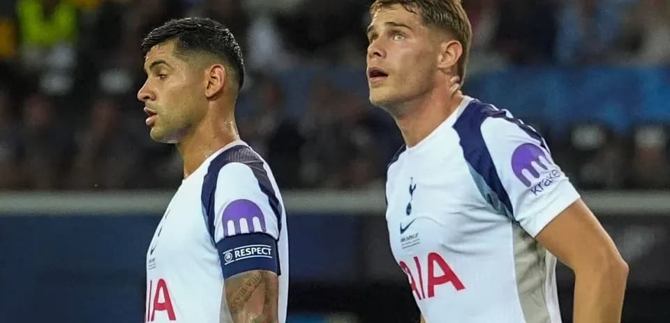 Two Tottenham players observing the match action